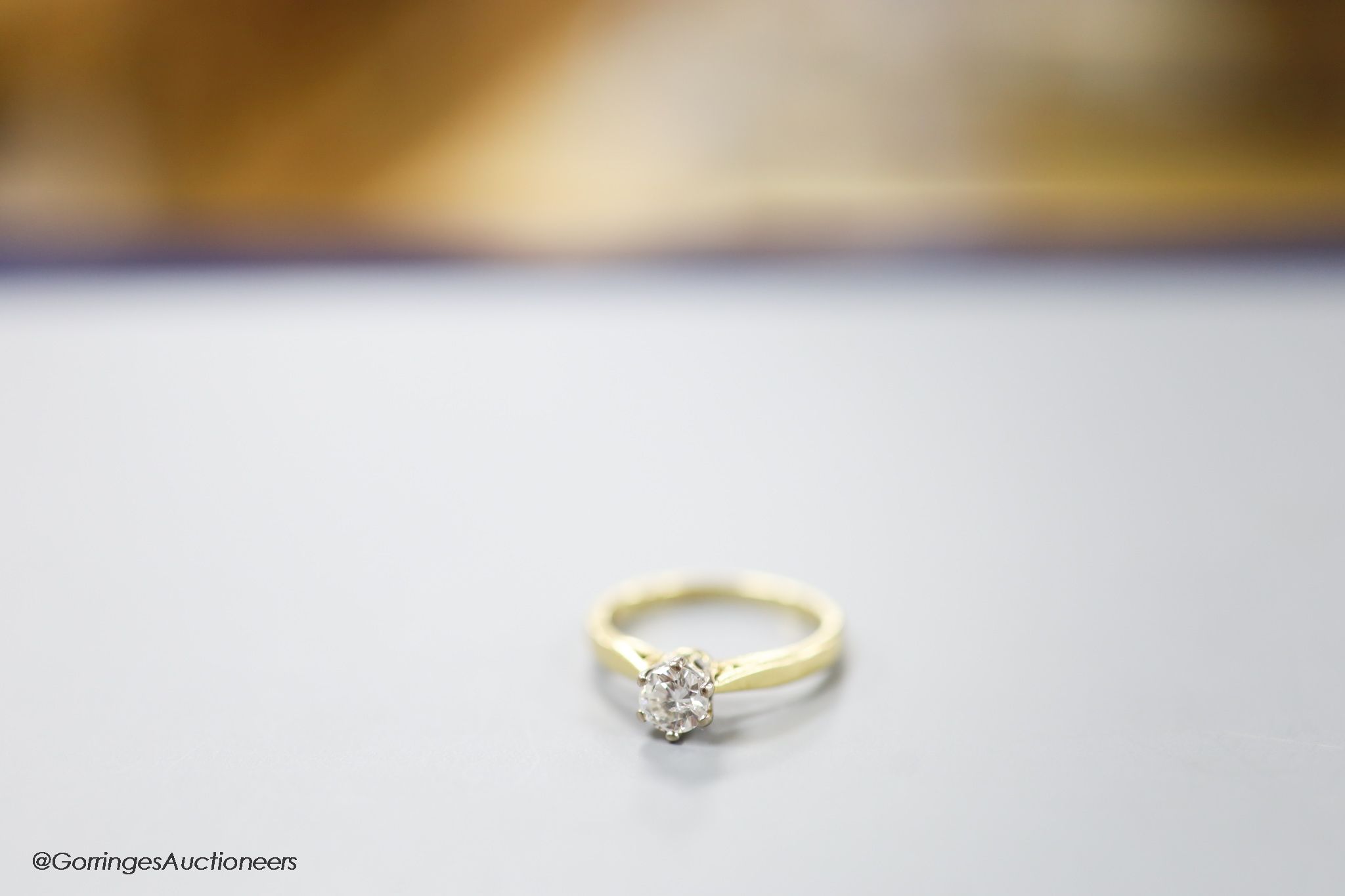 A modern 18ct gold and solitaire diamond ring, size L, gross weight 3.2 grams.